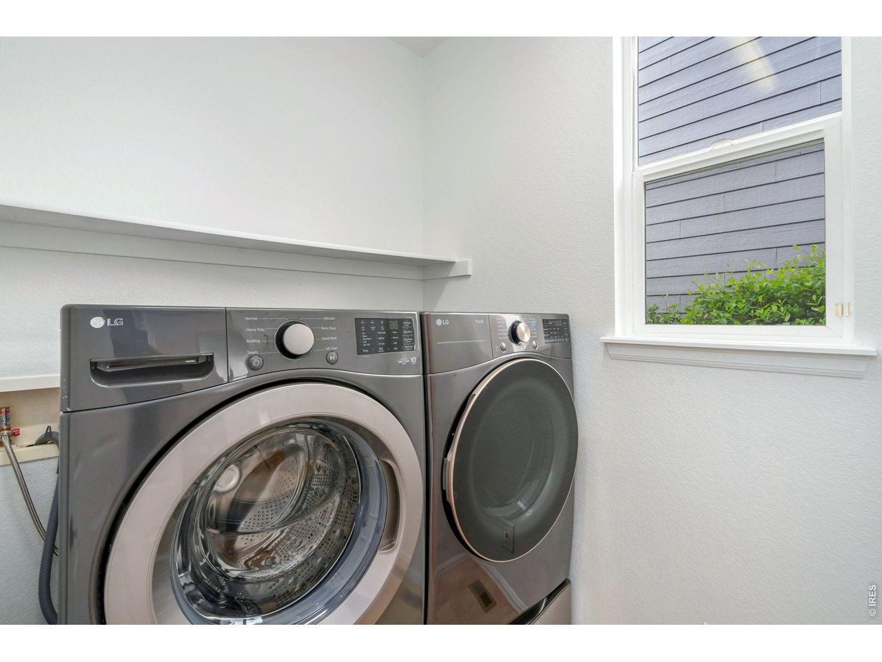5574 Quarry Street Timnath, CO 80547 - Photo 29 of 43 a utility room with dryer and washer