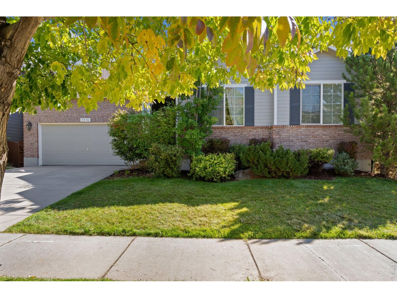 5574 Quarry Street Timnath, CO 80547 - Photo 4 of 43 a view of a house with a garden