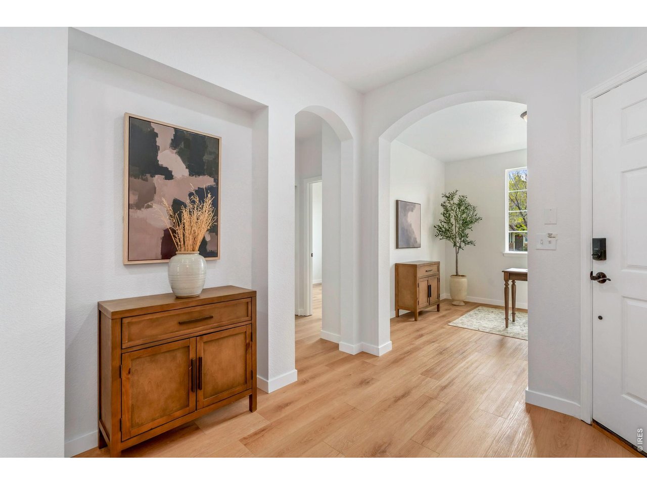 5574 Quarry Street Timnath, CO 80547 - Photo 5 of 43 a view of a livingroom with wooden floor and furniture