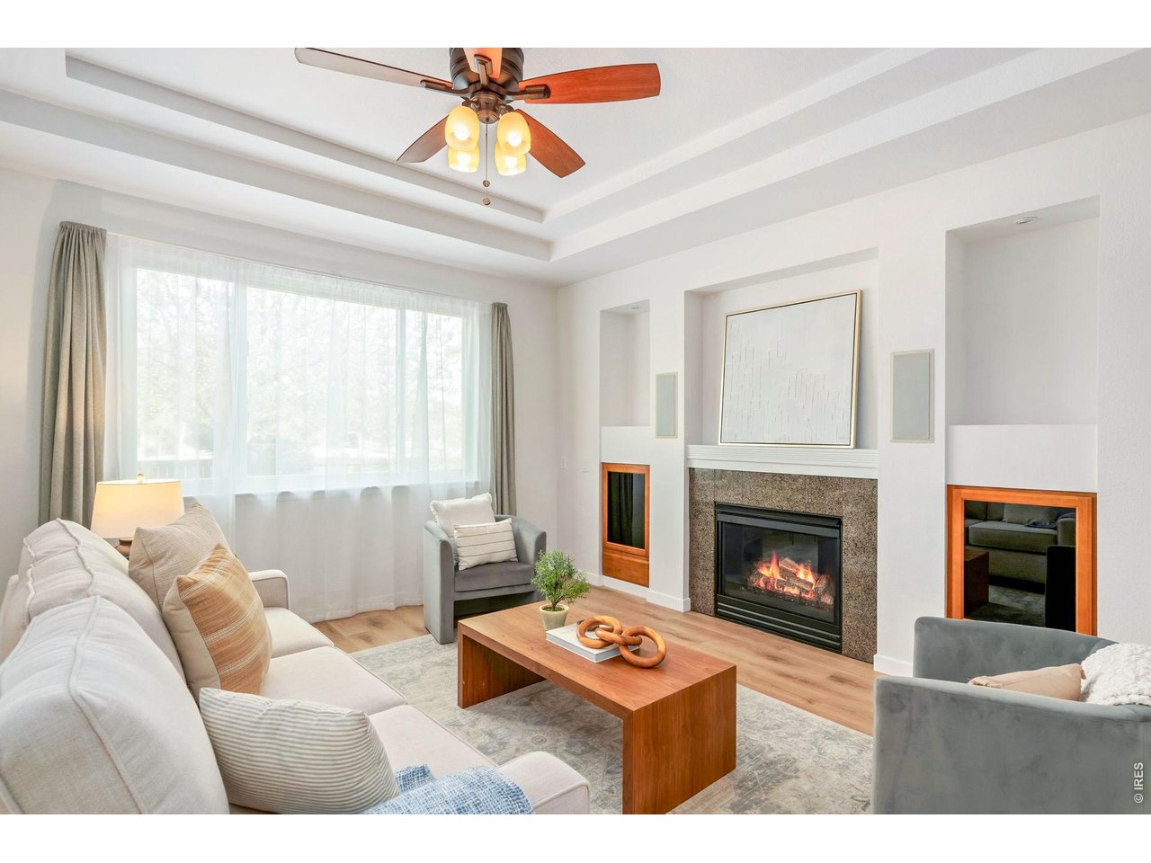 5574 Quarry Street Timnath, CO 80547 - Photo 6 of 43 a living room with furniture and a fireplace