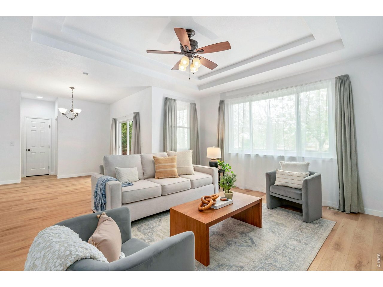 5574 Quarry Street Timnath, CO 80547 - Photo 7 of 43 a living room with furniture and a large window