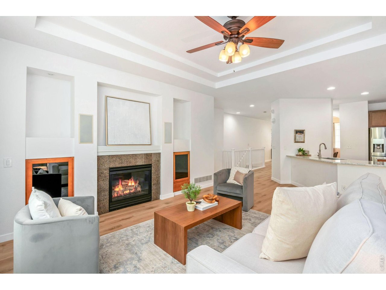 5574 Quarry Street Timnath, CO 80547 - Photo 8 of 43 a living room with furniture and a fireplace