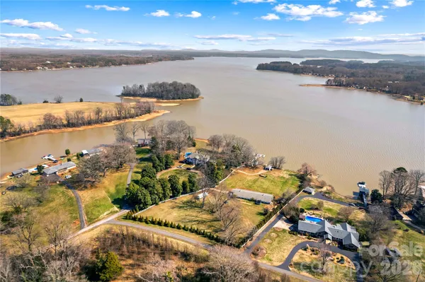 a view of road with large trees