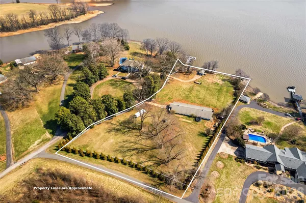 a swimming pool with an outdoor seating and yard