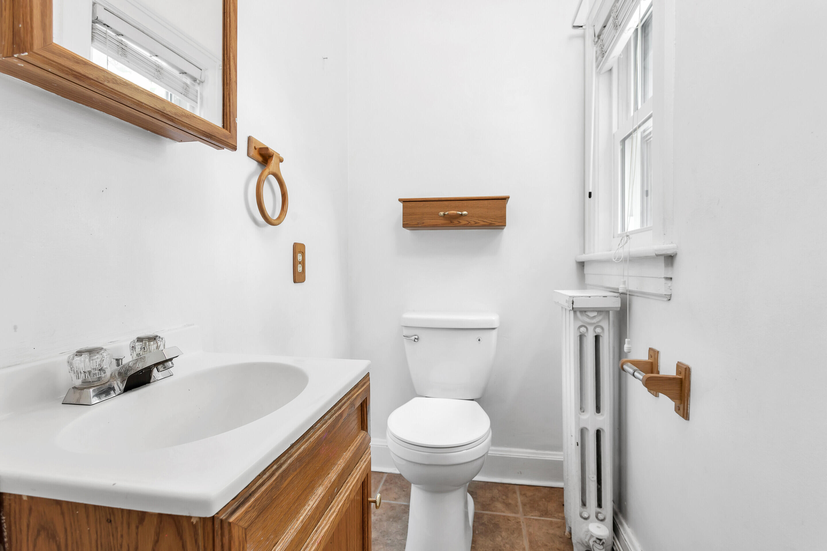1809 Canterbury Road Southwest Roanoke, VA 24015 - Photo 13 of 29 a bathroom with a sink toilet and shower