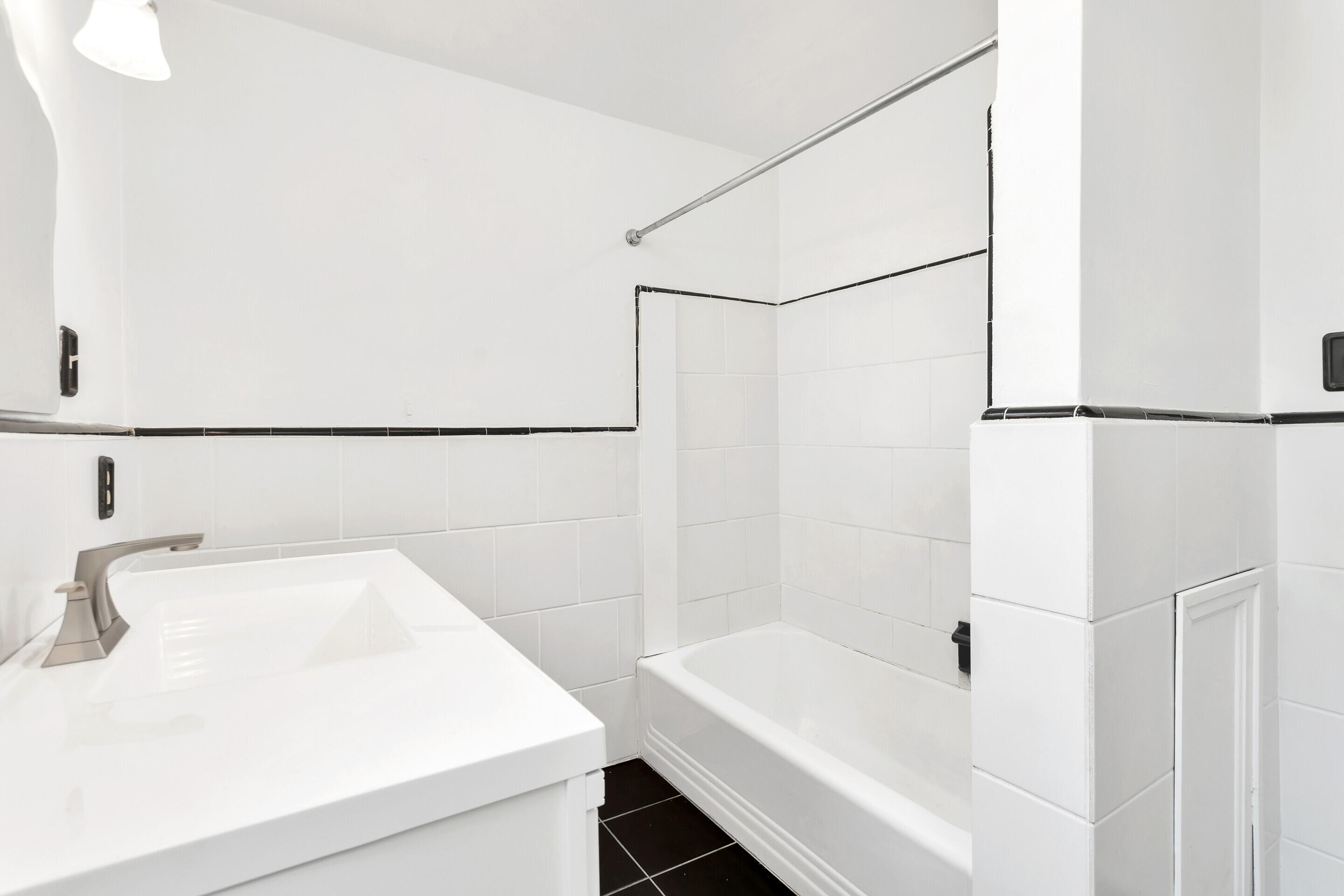 1809 Canterbury Road Southwest Roanoke, VA 24015 - Photo 15 of 29 a bathroom with a sink and a bathtub