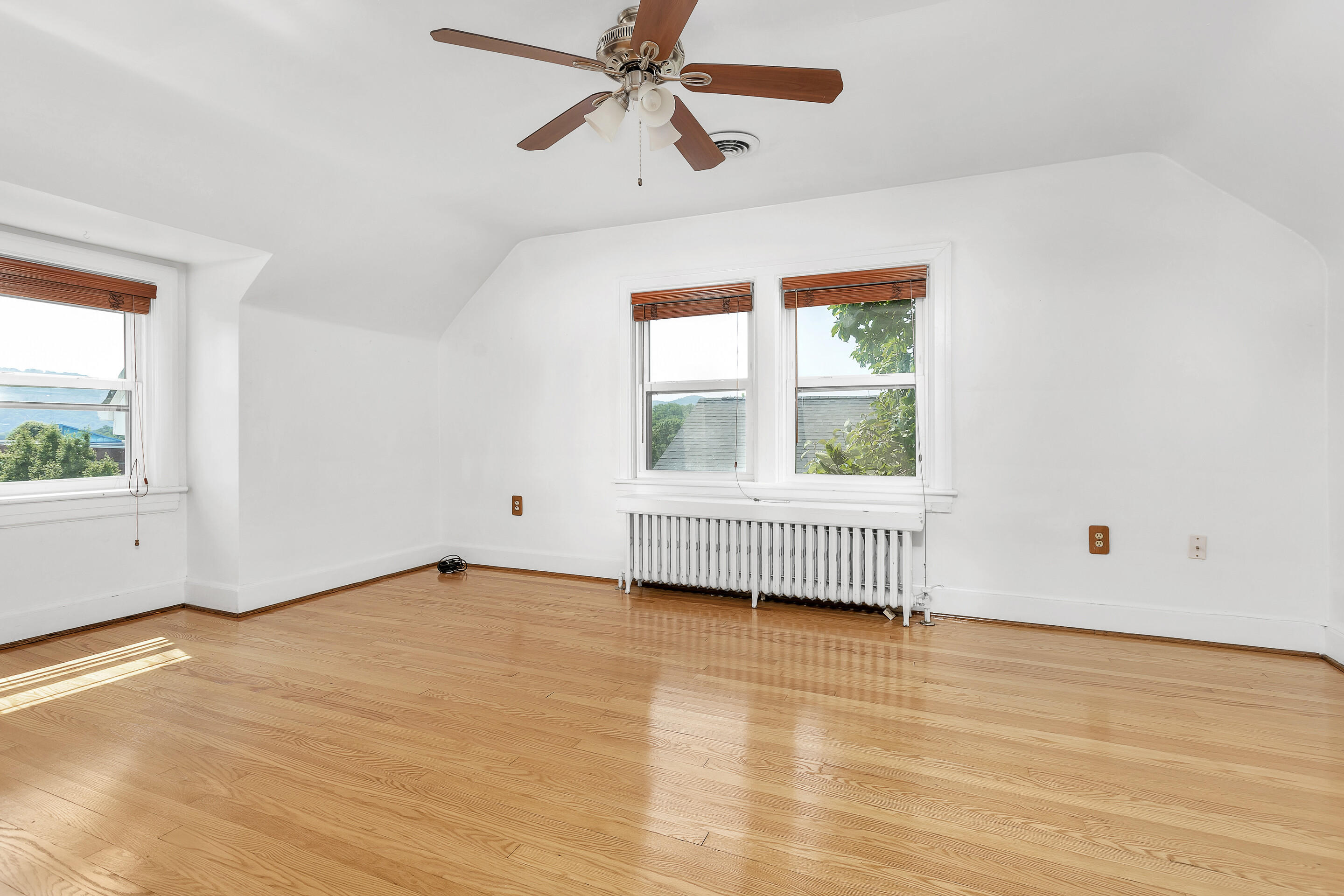 1809 Canterbury Road Southwest Roanoke, VA 24015 - Photo 17 of 29 an empty room with a window and a ceiling fan