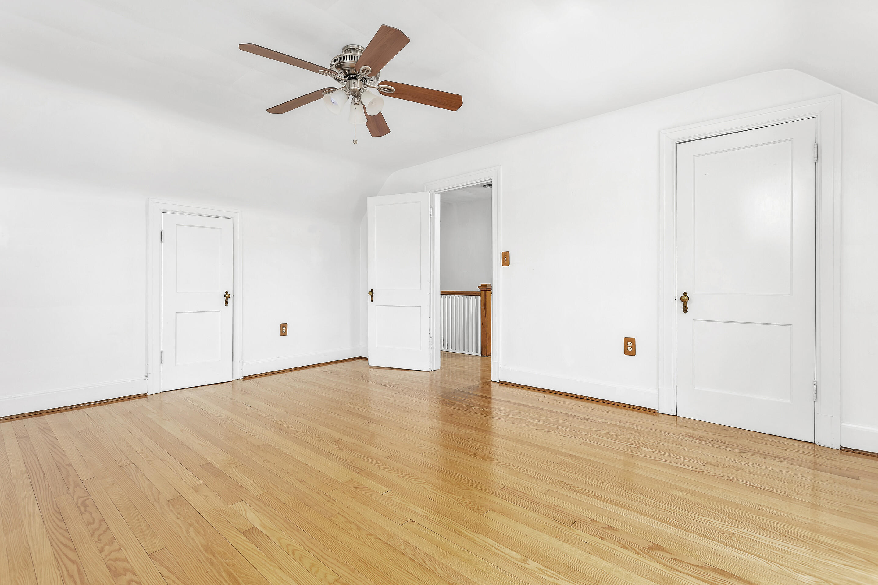 1809 Canterbury Road Southwest Roanoke, VA 24015 - Photo 18 of 29 an empty room with wooden floor and ceiling fan