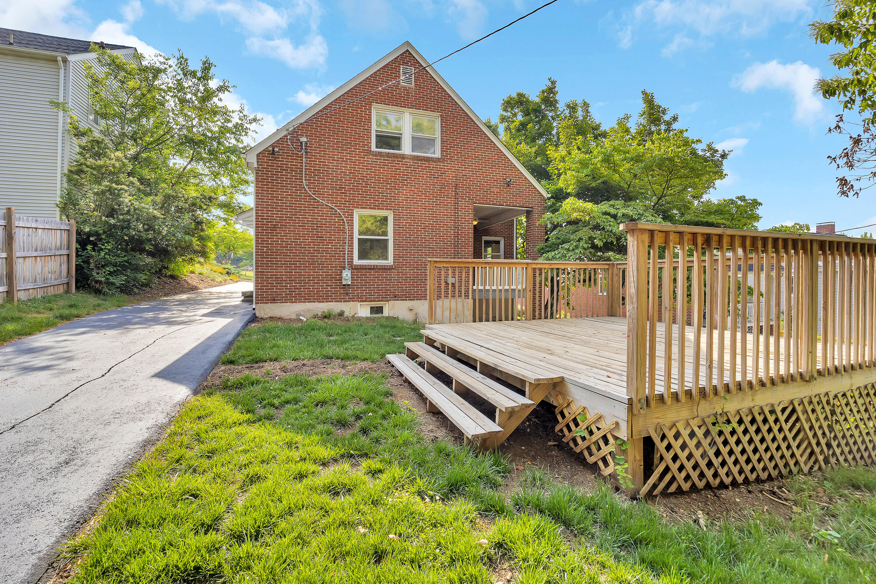 1809 Canterbury Road Southwest Roanoke, VA 24015 - Photo 29 of 29 a view of a house with backyard and a tree