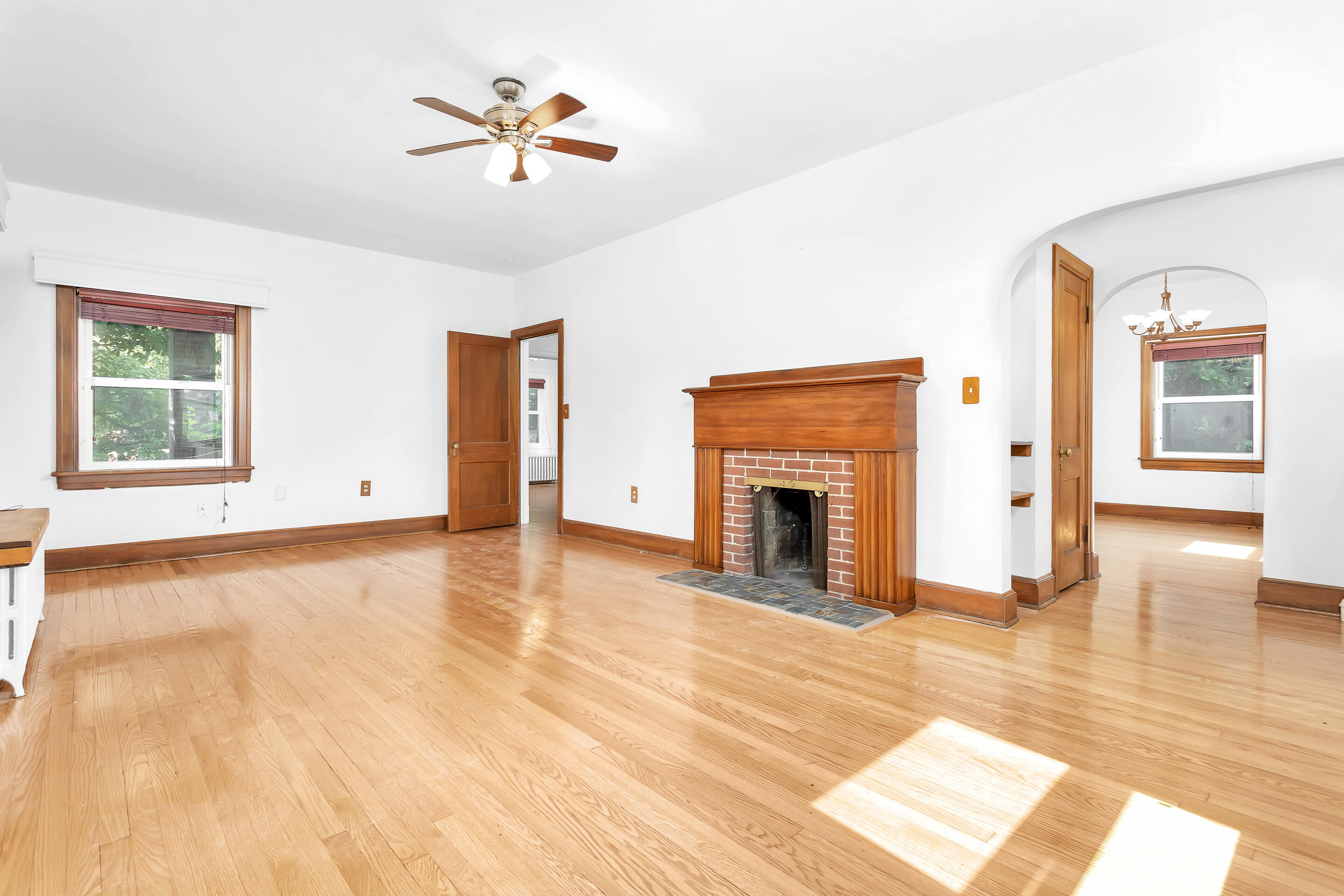 1809 Canterbury Road Southwest Roanoke, VA 24015 - Photo 4 of 29 a view of empty room with fireplace and wooden floor