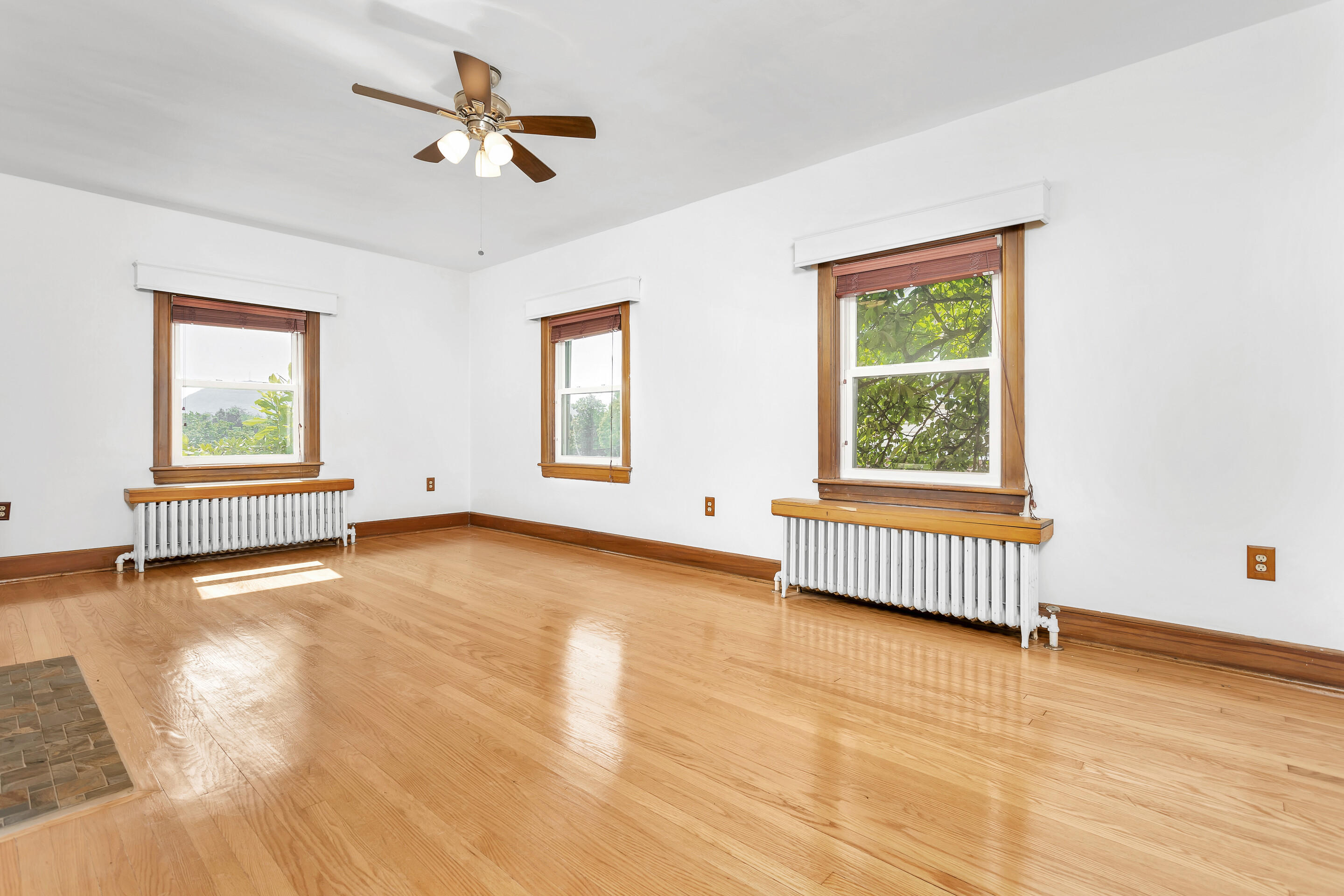 1809 Canterbury Road Southwest Roanoke, VA 24015 - Photo 5 of 29 a view of an empty room with a window and wooden floor