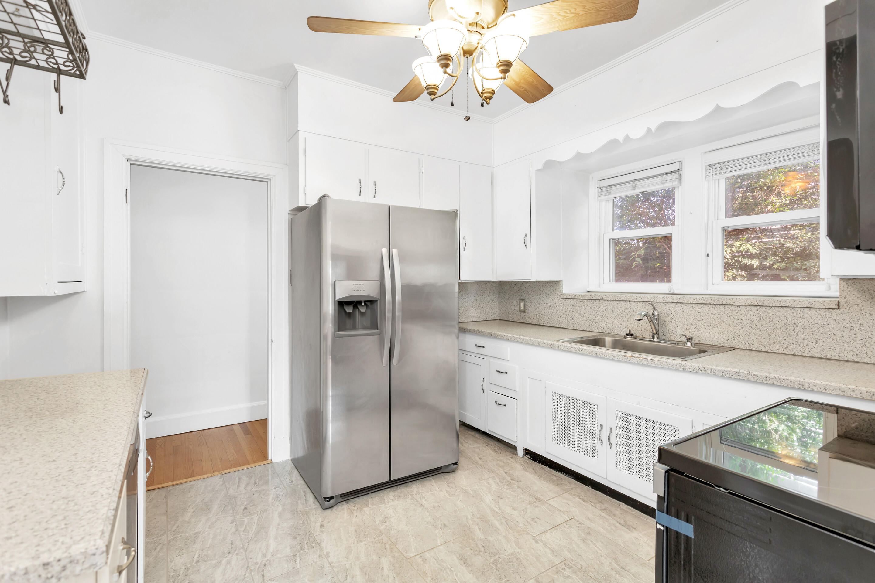 1809 Canterbury Road Southwest Roanoke, VA 24015 - Photo 8 of 29 a kitchen with stainless steel appliances granite countertop a refrigerator and a sink