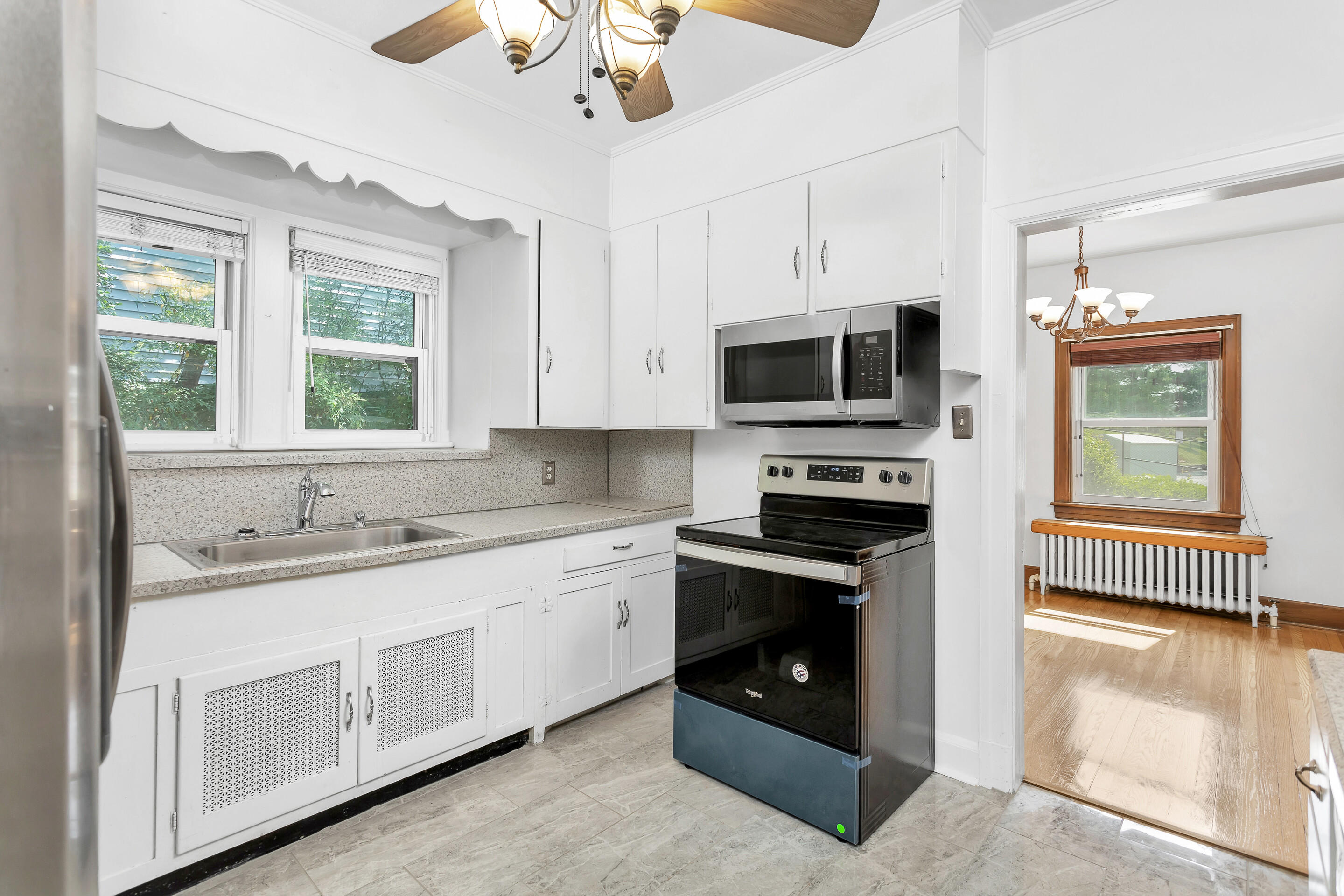 1809 Canterbury Road Southwest Roanoke, VA 24015 - Photo 9 of 29 a kitchen with stainless steel appliances granite countertop a stove and a sink