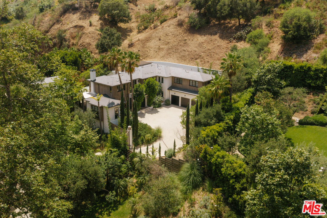 1105 Rivas Canyon Road Pacific Palisades, CA 90272 - Photo 1 of 49 a view of a house with a yard