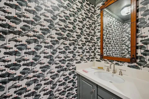 a bathroom with a sink and a mirror