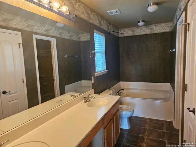 a view of bathroom with dual sinks