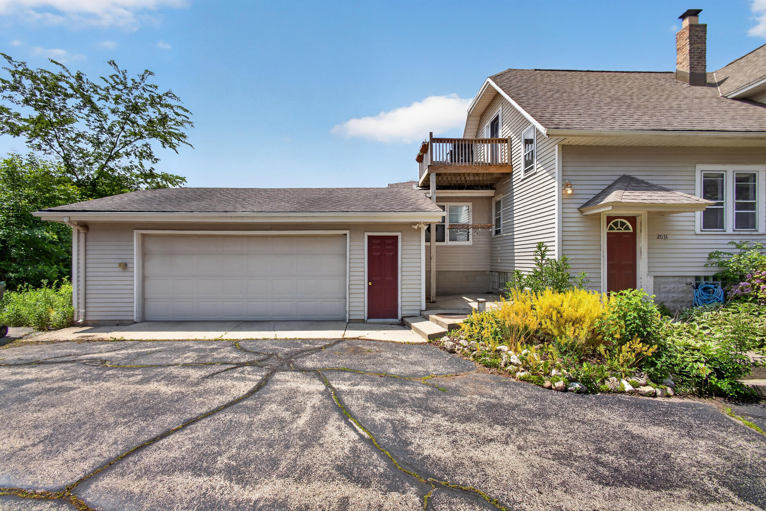 2029 West Donges Bay Road, Unit 2031 Mequon, WI 53092 - Photo 64 of 68 Garage and Driveway