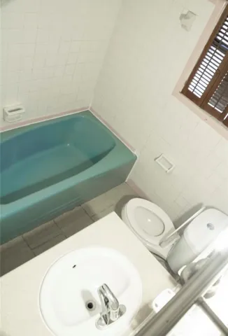 a bathroom with a toilet and a sink