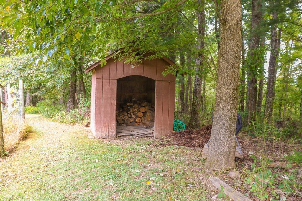 197 Silverleaf Road Southeast Floyd, VA 24091 - Photo 26 of 27 a stone house with trees in front of it