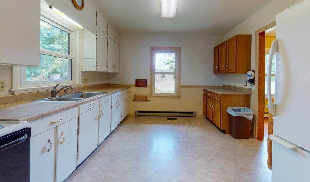 197 Silverleaf Road Southeast Floyd, VA 24091 - Photo 4 of 27 a kitchen with a sink a stove and cabinets