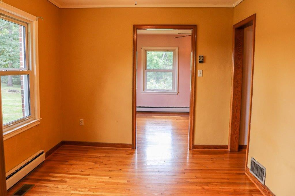 197 Silverleaf Road Southeast Floyd, VA 24091 - Photo 6 of 27 a view of empty room with wooden floor and fan