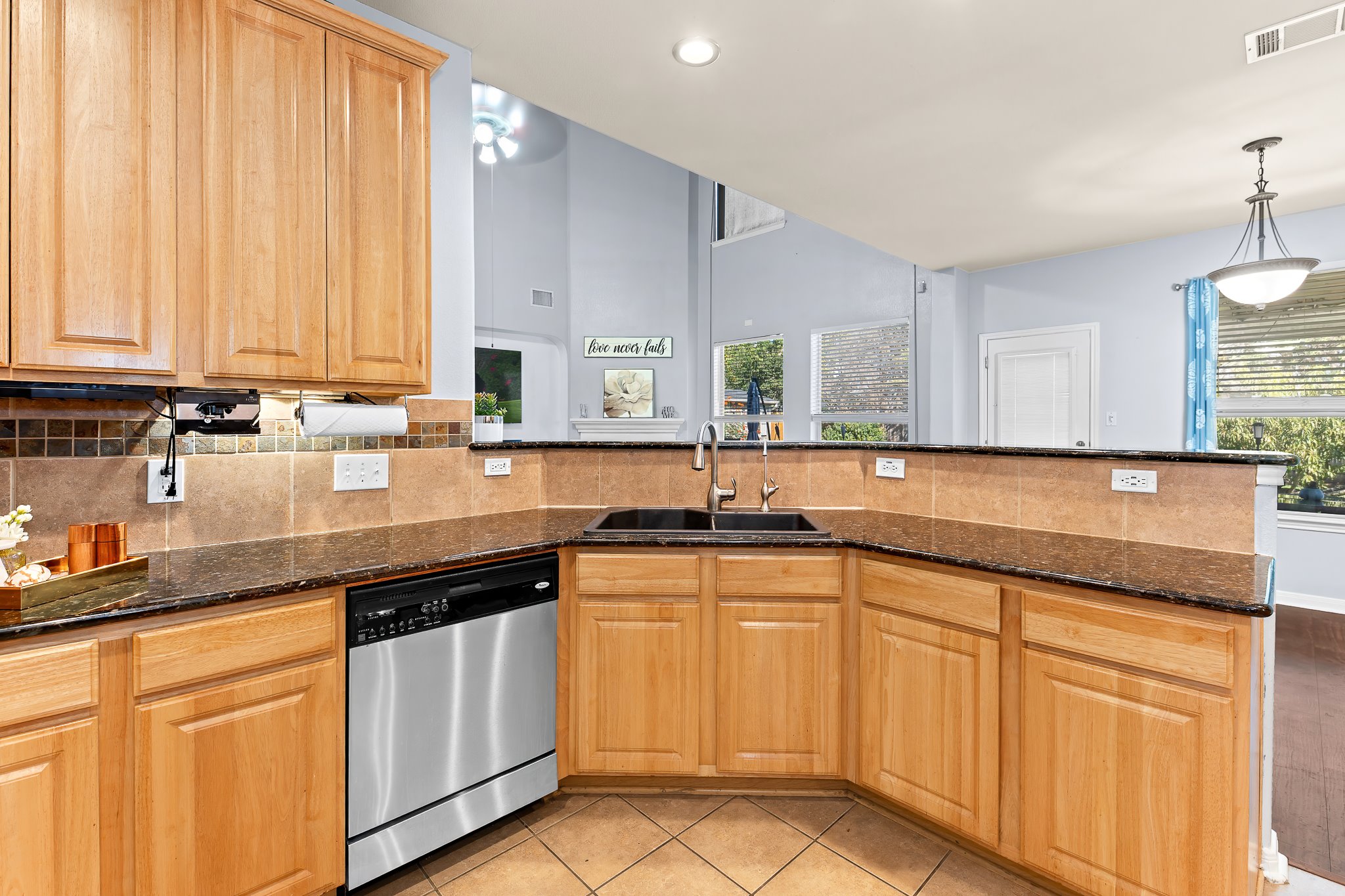 1211 Laurel Oak Trail Pflugerville, TX 78660 - Photo 15 of 40 a kitchen with granite countertop white cabinets and white appliances