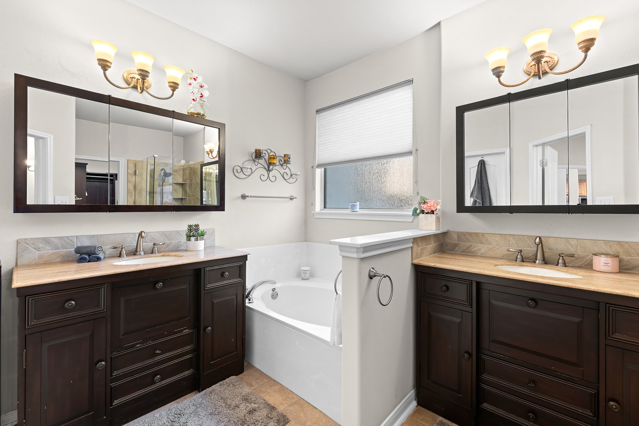 1211 Laurel Oak Trail Pflugerville, TX 78660 - Photo 24 of 40 a bathroom with a double vanity sink and a mirror