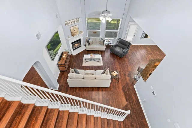 a view of entryway and hall with wooden floor