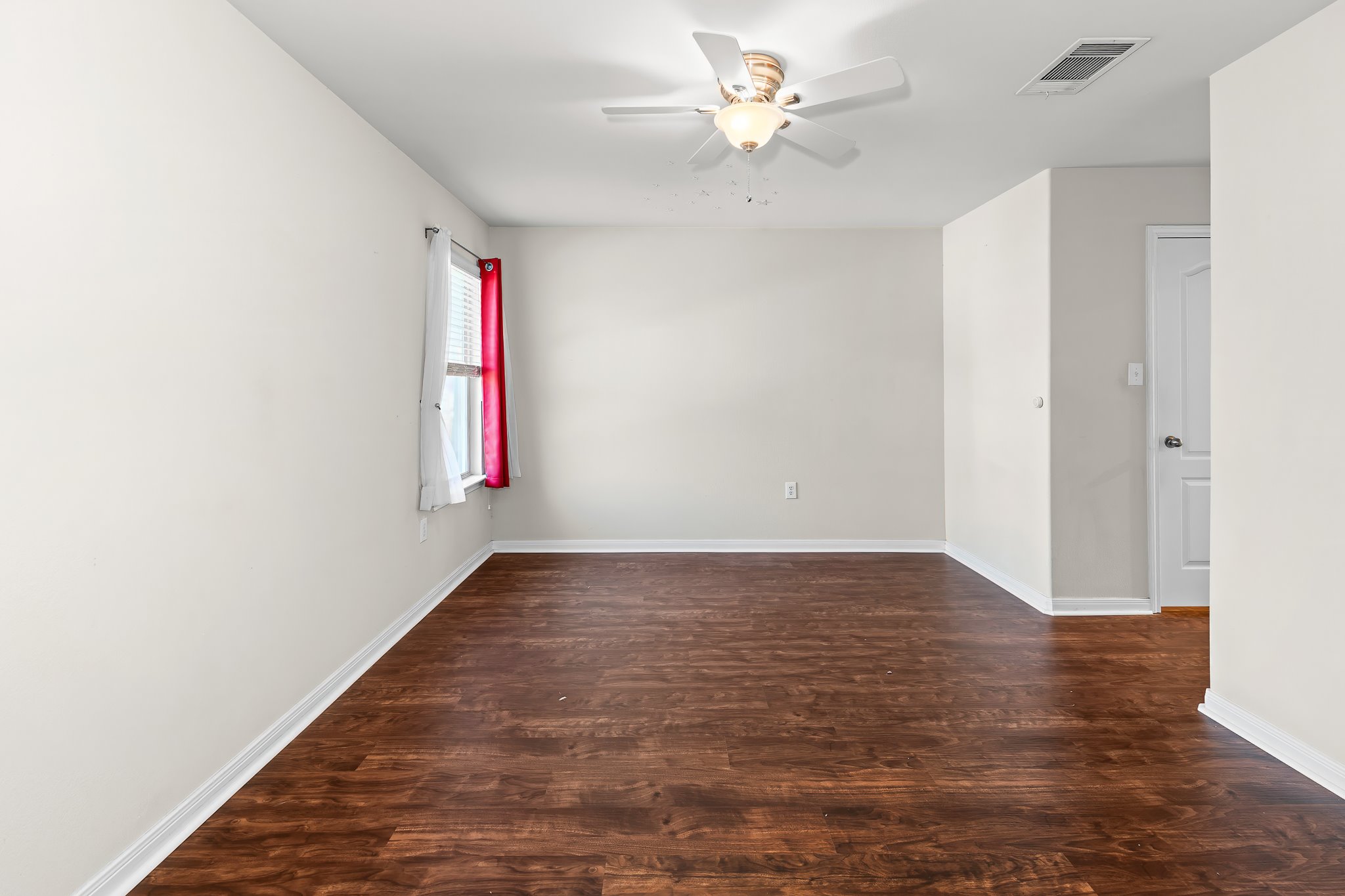 1211 Laurel Oak Trail Pflugerville, TX 78660 - Photo 29 of 40 an empty room with windows and fan