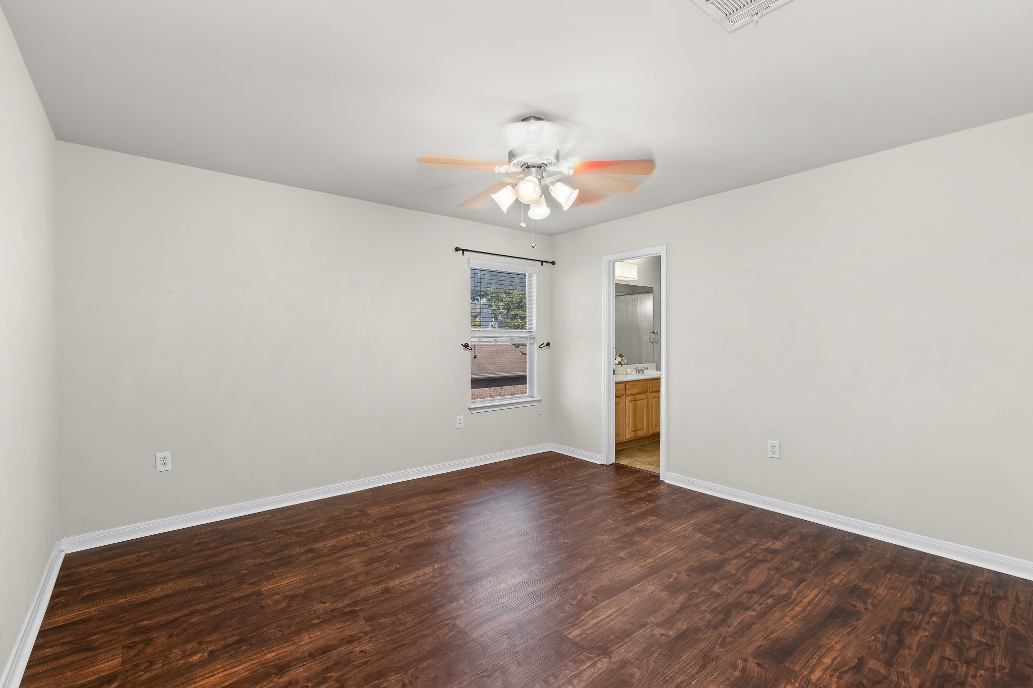 1211 Laurel Oak Trail Pflugerville, TX 78660 - Photo 31 of 40 wooden floor in an empty room with a window