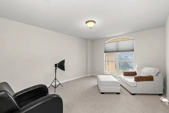 a bedroom with furniture and a window