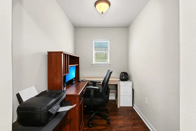 a workspace with furniture and wooden floor