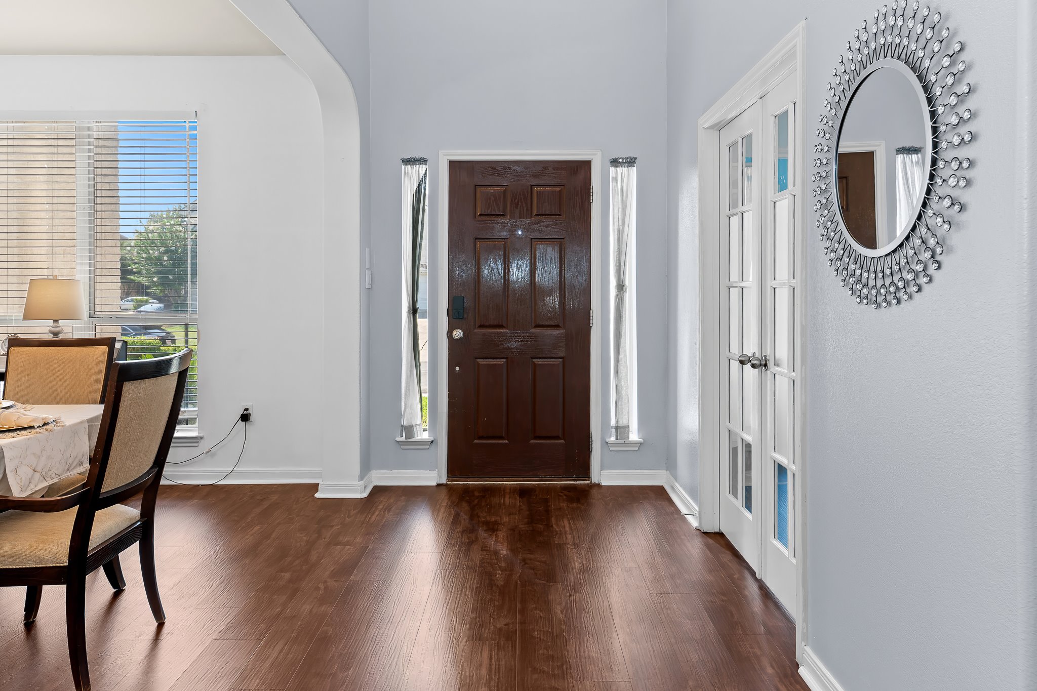 1211 Laurel Oak Trail Pflugerville, TX 78660 - Photo 5 of 40 a view of a hallway with wooden floor and windows