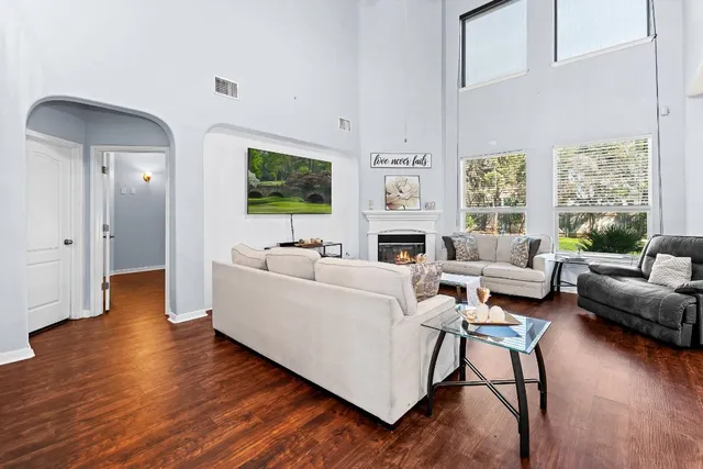 a living room with furniture and a fireplace