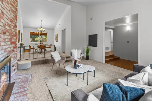 a kitchen with cabinets appliances a sink and a window