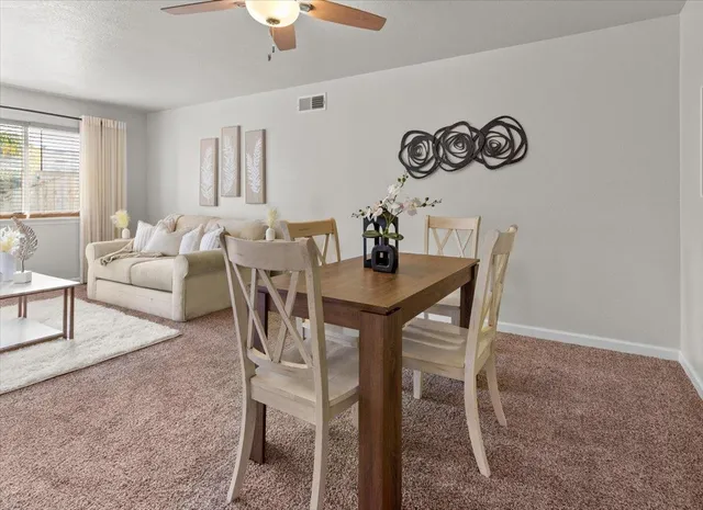 a white toilet sitting next to a bathroom sink