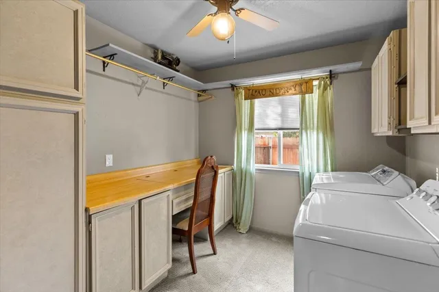 a spacious bathroom with a granite countertop sink and a mirror