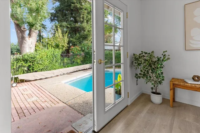 a view of a street with a car parked in front of it
