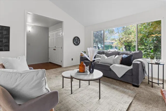 a kitchen with cabinets appliances and a window