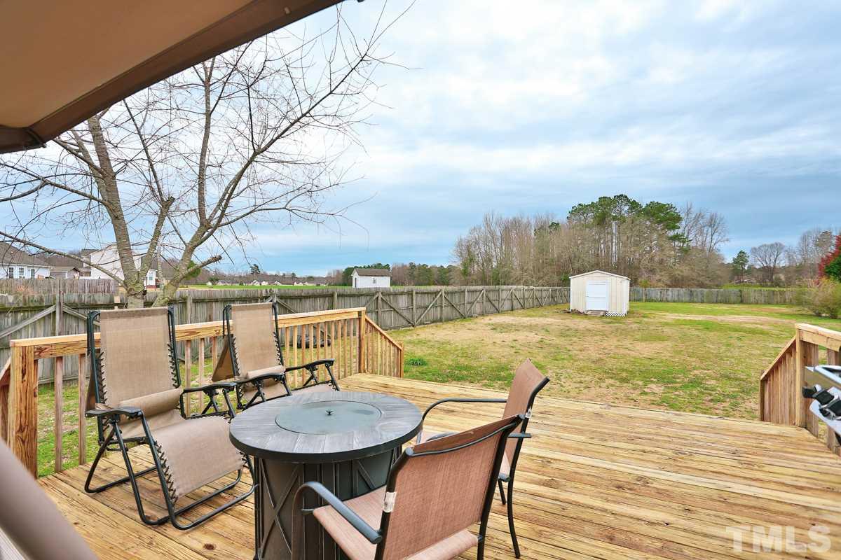 243 Rosa Circle Willow Spring, NC 27592 - Photo 22 of 28 a view of a swimming pool with a patio