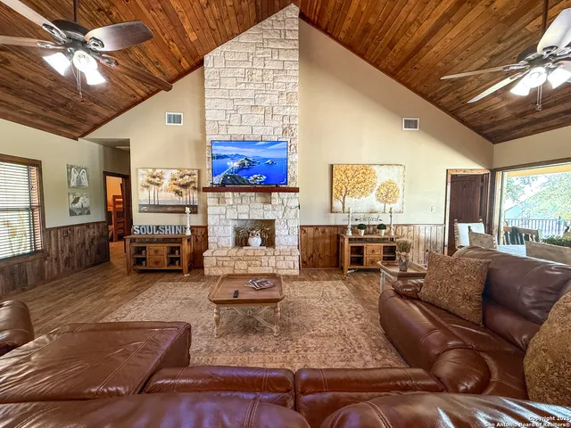a living room with fireplace furniture and a fireplace