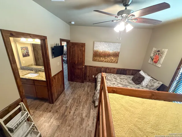 a view of a living room with furniture and a flat screen tv