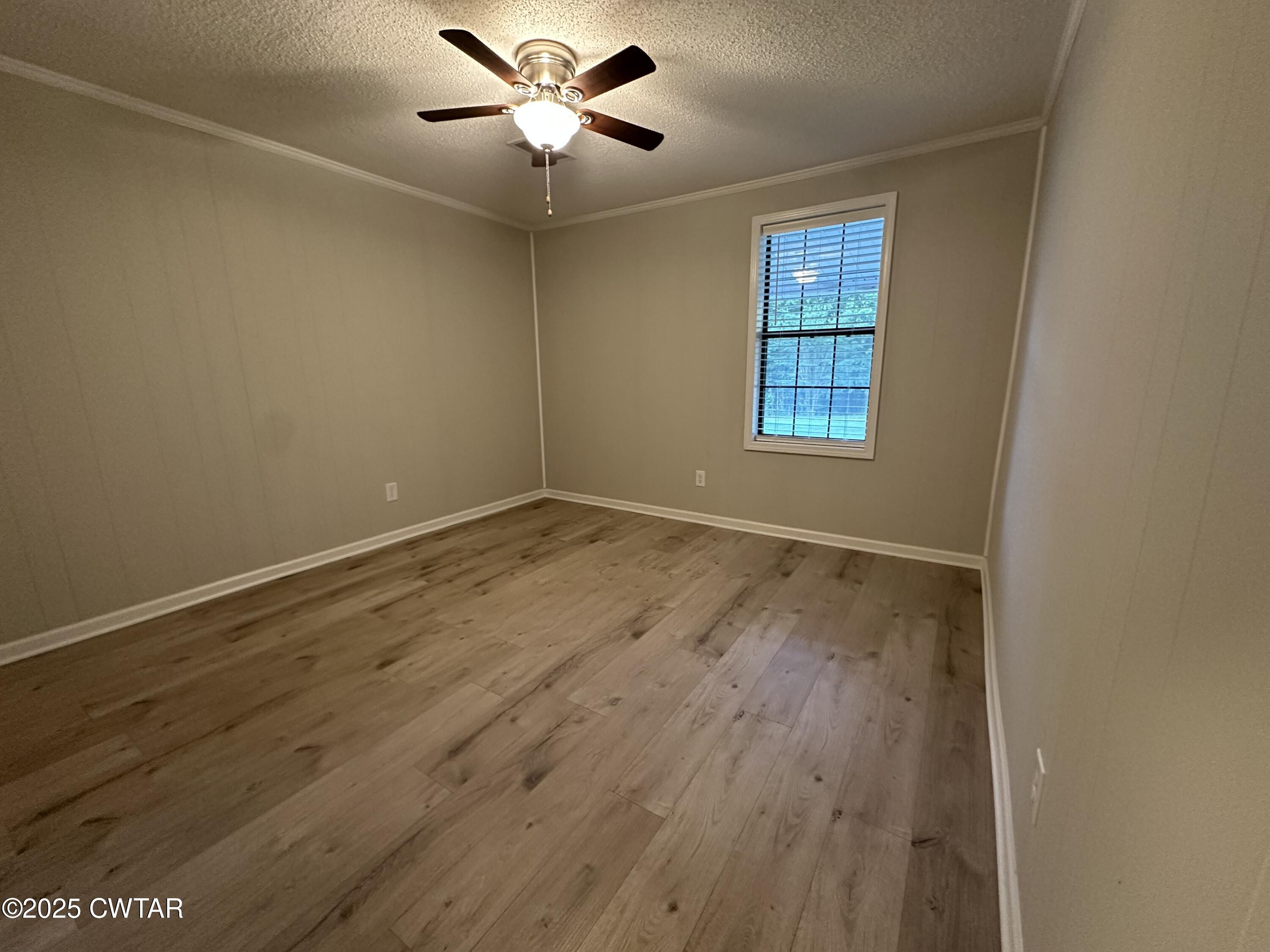 1975 Old Toone Road Medon, TN 38356 - Photo 13 of 21 wooden floor in an empty room with a window