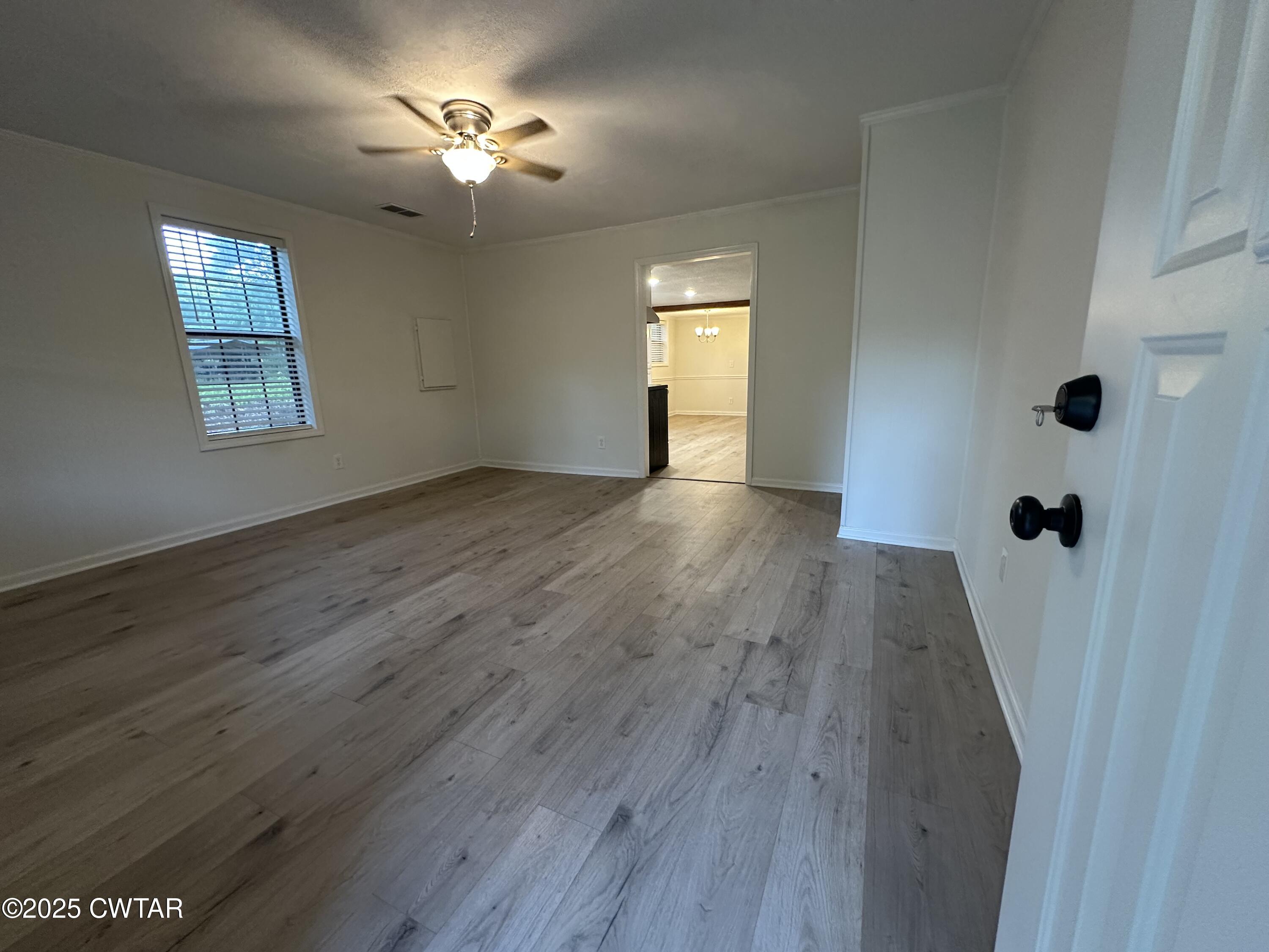 1975 Old Toone Road Medon, TN 38356 - Photo 3 of 21 wooden floor in an empty room with a window