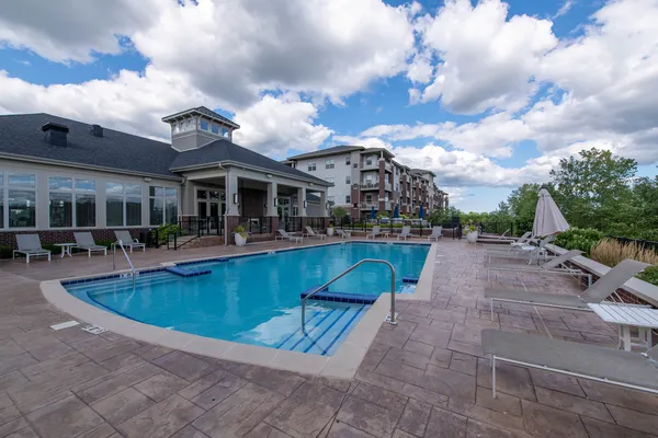 a view of a swimming pool with a patio