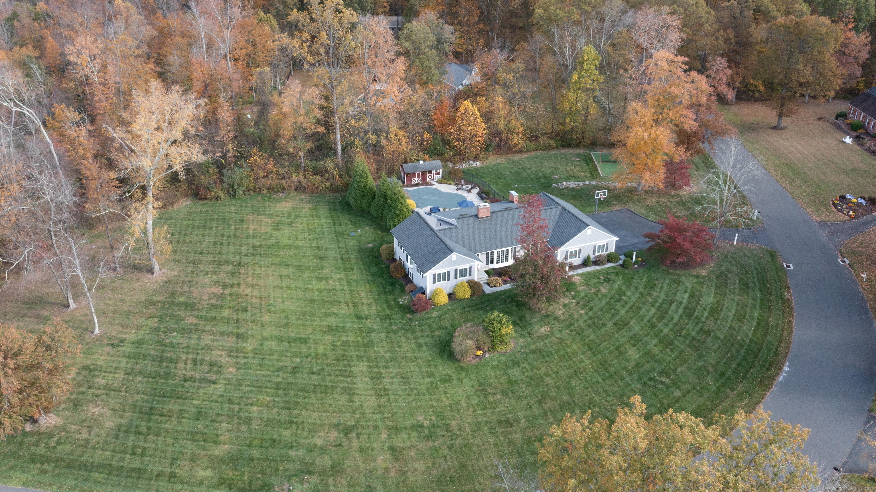 an aerial view of a house with a yard