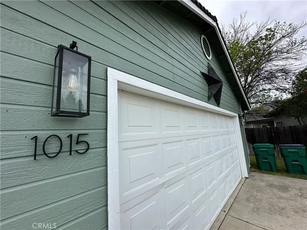 a view of a backyard with a small cabin and chair