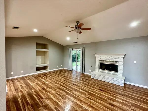 a kitchen with granite countertop stainless steel appliances cabinets and a sink