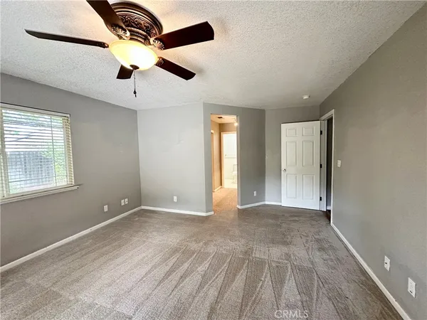 an empty room with closet area