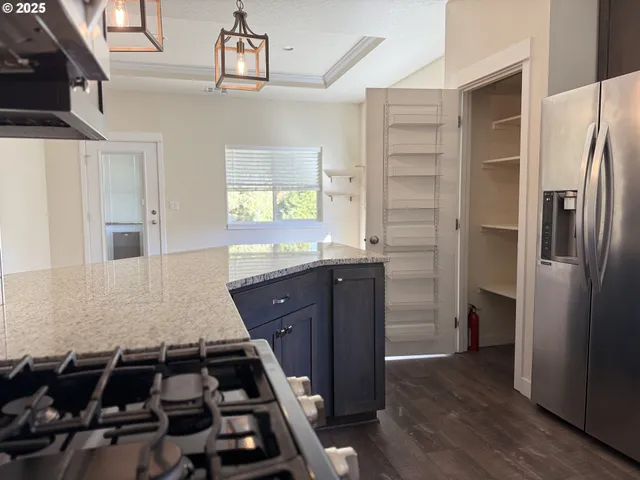 a kitchen with a refrigerator and a sink